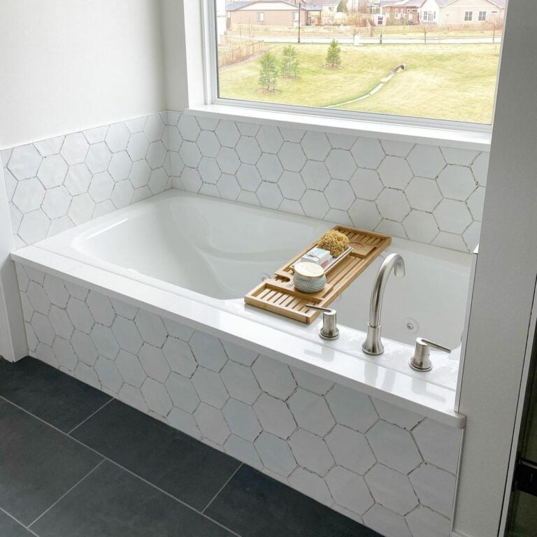 Hexagon Tile Surrounds an Alcove Bathtub