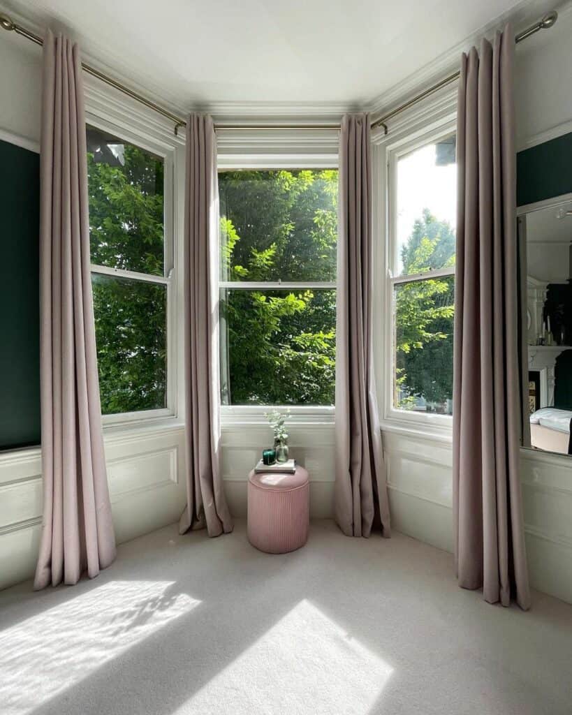 Luxurious Pale Pink Drapes Surround Bay Windows