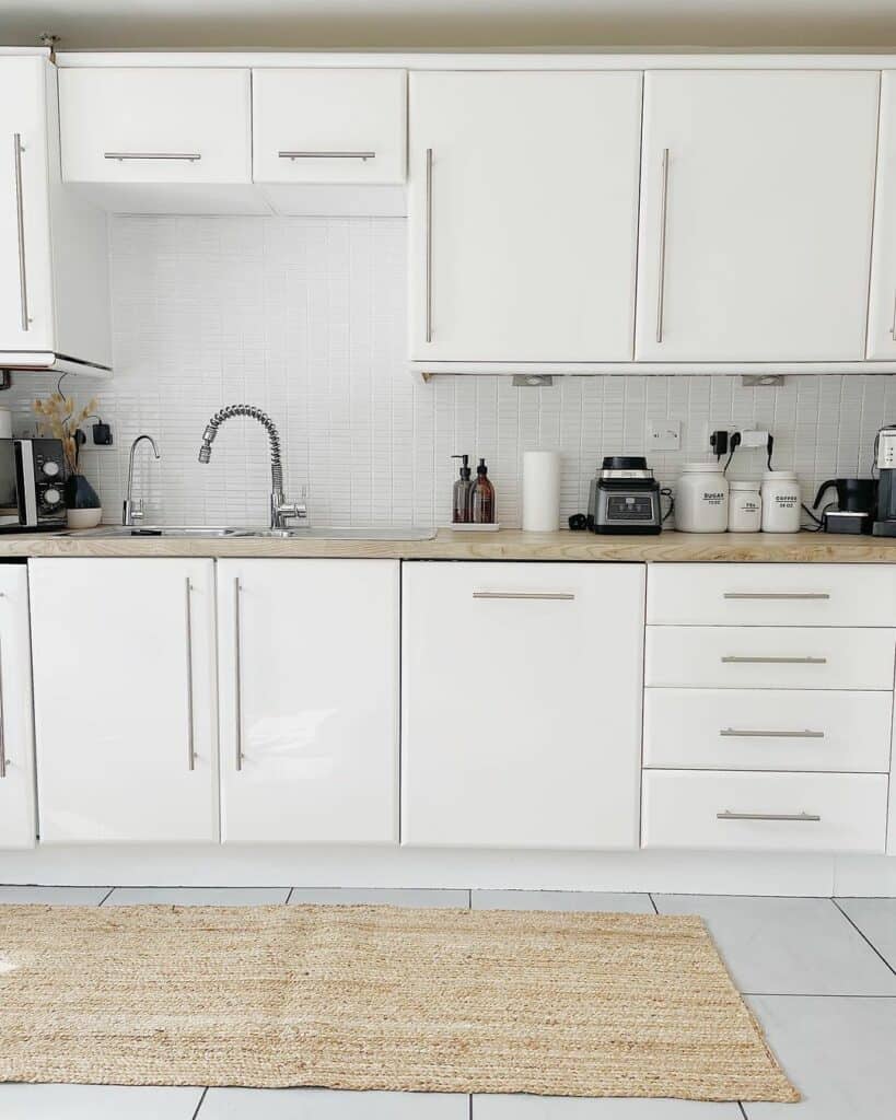 Nickel Pulls Adorn Flat Paneled Cabinets