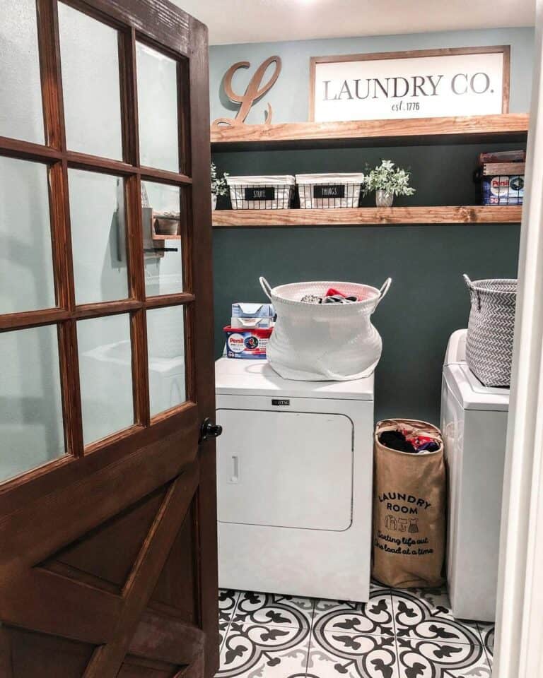 Rustic Door Opens Into a Farmhouse-style Laundry Room