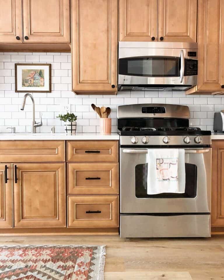 Stainless Steel Appliances With Warm Wood Cabinets