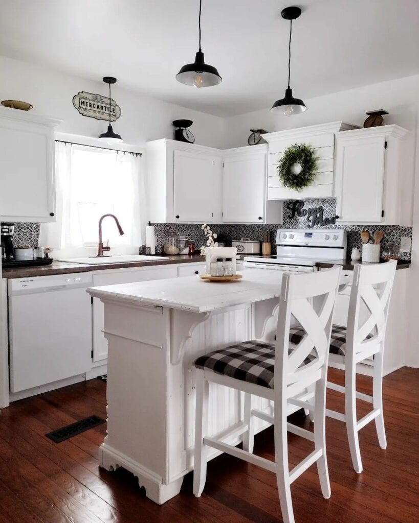 White Kitchen With Black Pendant Lights