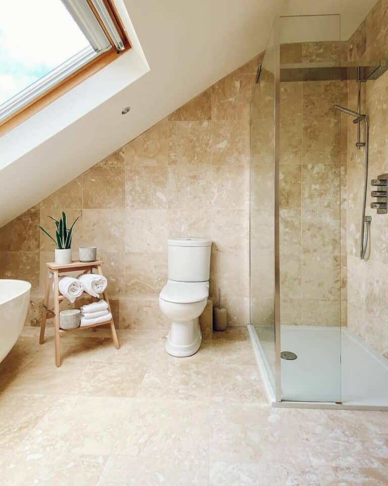 Floor to Ceiling Tiled Bathroom With Slanted Ceiling