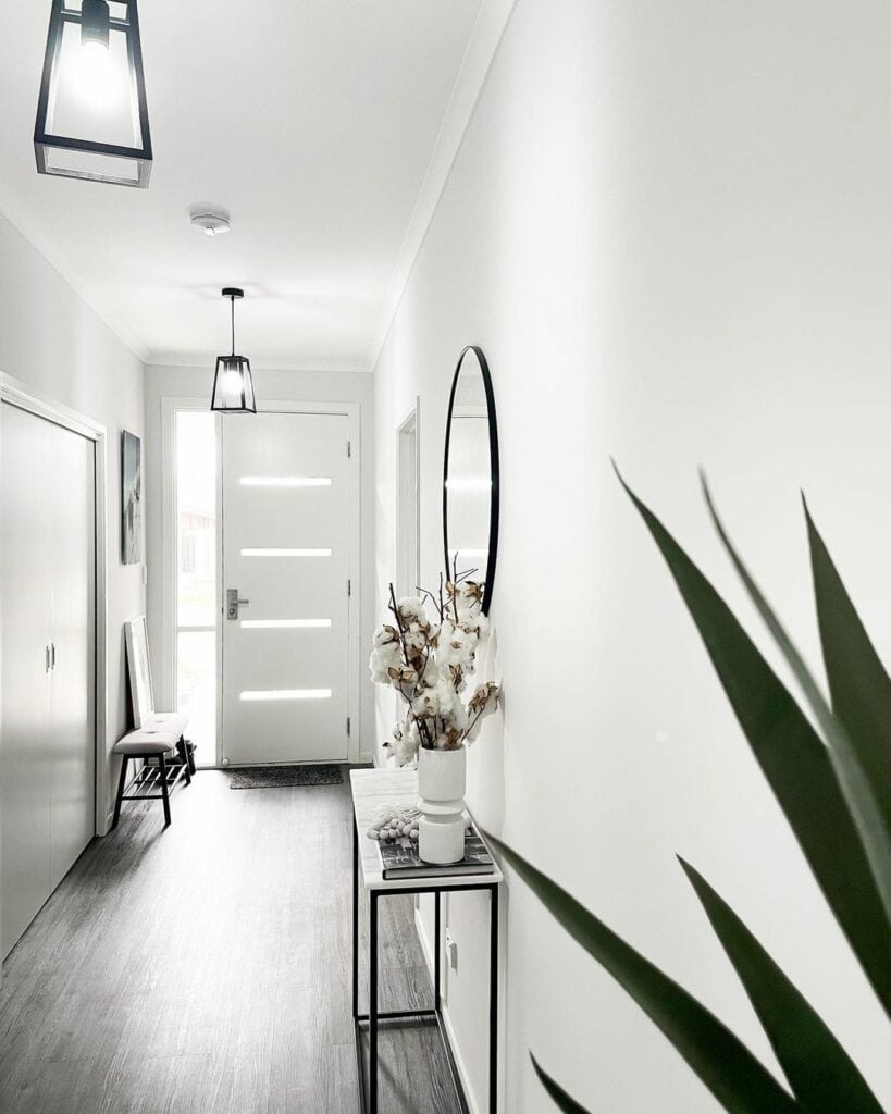 Minimalist White Hallway Styling With Black Accents