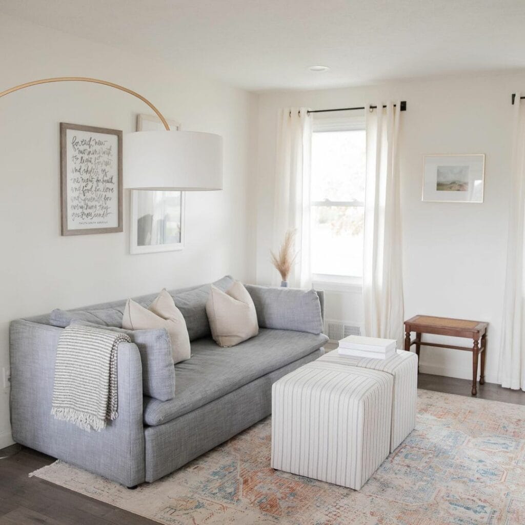 Neutral Living Area With Double Striped Ottomans