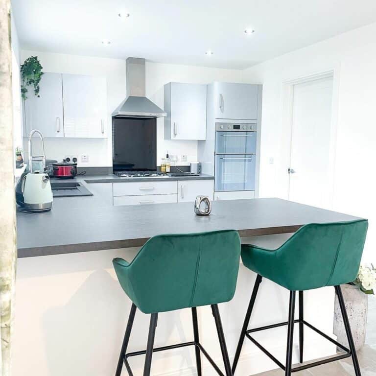 Small White Kitchen With Pops of Emerald Green